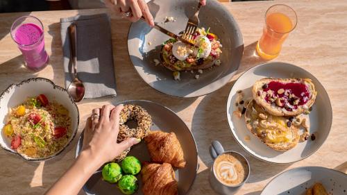 a table with three plates of food on it at Renaissance Bali Nusa Dua Resort in Nusa Dua