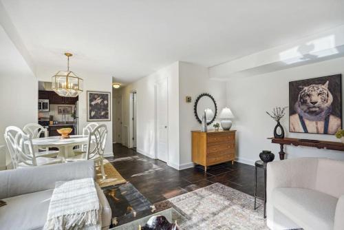 a living room with a couch and a table at Crystal City Charm Free Parking 102 in Arlington