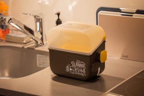 a toaster sitting on a kitchen counter next to a sink at Rakuten STAY Nikko Hoden in Nikko