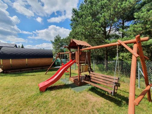 Herní místnost nebo prostor pro děti v ubytování Mazury w Pigułce- domek z sauną i balią, Woszczele