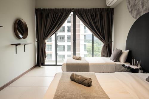 a hotel room with two beds and a large window at K Avenue by CAIRO in Donggongon