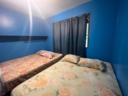 Postel nebo postele na pokoji v ubytování Las Casitas de Playa Ne gra