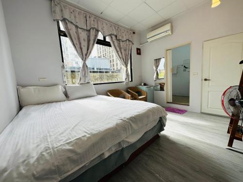 Postel nebo postele na pokoji v ubytování Zhixinyuan B&B