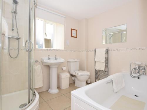 a white bathroom with a toilet and a sink at 2 Bed in Rowlands Gill CN192 in Stanley