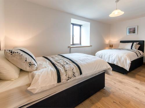 a bedroom with two beds and a window at 2 bed property in Nidderdale HH011 