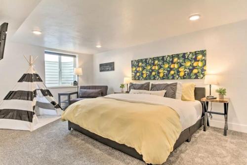 a bedroom with a large bed with a painting on the wall at Sleek Great Falls Retreat in Great Falls