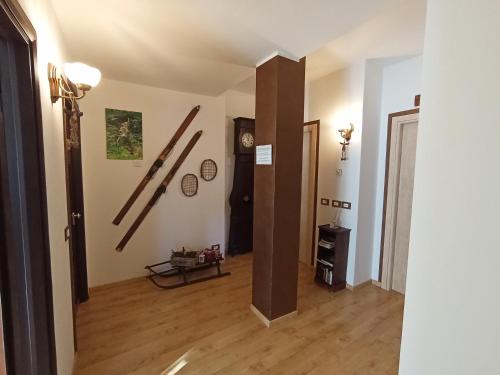 a room with a hallway with a clock on the wall at LA ROCCA BIANCA in Demonte