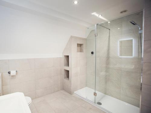 a bathroom with a shower with a glass door at 5 Bed in Bishops Frome 75602 in Bishops Frome