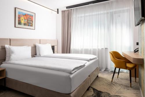Кровать или кровати в номере Hotel Alexandrion Experience