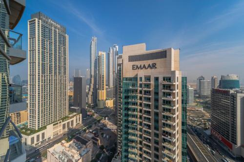 a tall building with the word banyon on it in a city at Boutique Living - Burj Views - Renovated in Dubai