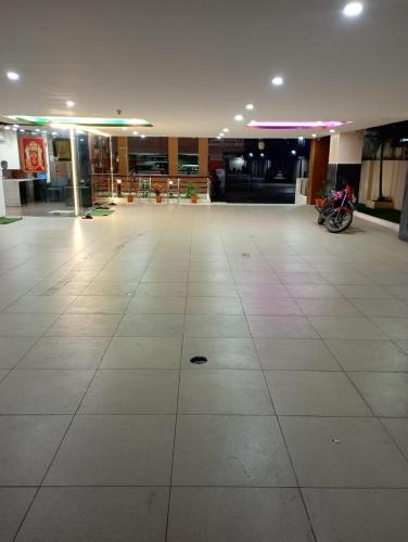 a large room with a large white tile floor at Hotel Sri Capital Residency in Vijayawāda