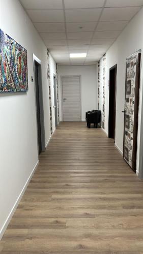 a hallway of an art gallery with a painting on the wall at Appartamenti ClesioResidenceBuonconsiglio in Trento