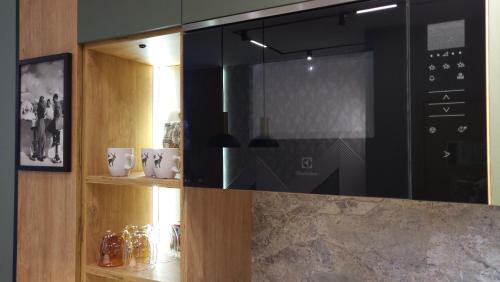 a kitchen with a large microwave in a room at Pinewood ANG premium luxurious apartment 15 in Borovets