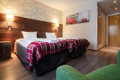 Postel nebo postele na pokoji v ubytování Lapland Hotels Sirkantähti