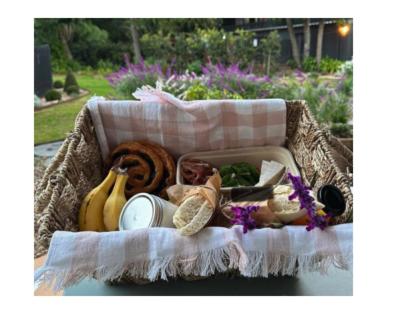 a basket filled with different types of fruits and vegetables at The Lodge Jamberoo in Jamberoo