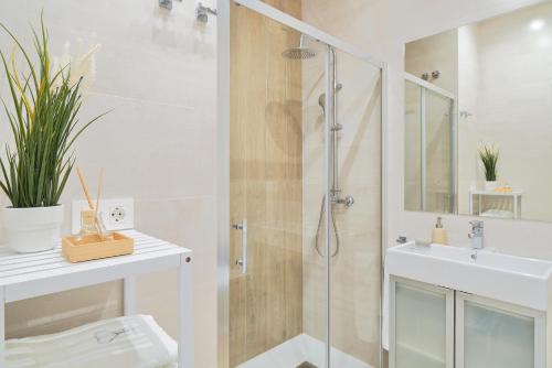 a bathroom with a shower and a sink at iloftmalaga Playa de Huelin in Málaga