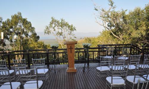 a bunch of chairs sitting on a deck at Shayamoya Tiger Fishing and Game Lodge in Pongola Game Reserve