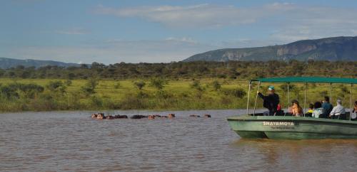 a group of people on a boat in the water at Shayamoya Tiger Fishing and Game Lodge in Pongola Game Reserve