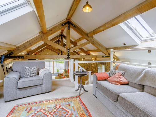 a living room with two chairs and a rug at 2 bed in Cowbridge 88000 in Llandow