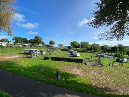 a field with a group of vehicles parked in it at EuroParcs Gulperberg in Gulpen