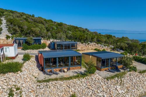 an aerial view of a house on a beach at Luxury Sea View Kasthouses - Happy Rentals in Mali Lošinj