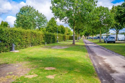 a street with trees on the side of a road at EuroParcs Poort van Maastricht in Berg en Terblijt