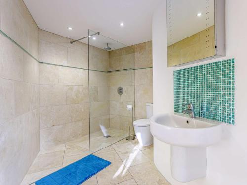a bathroom with a shower and a sink and a toilet at 2 Bed in Lympstone 80586 in Lympstone