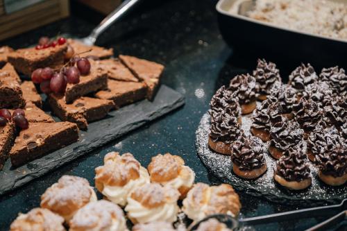 a bunch of different types of desserts on a table at Insel der Sinne in Görlitz