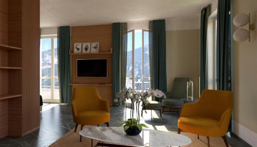 a living room with yellow chairs and a television at Hotel Belvedere in Bellagio