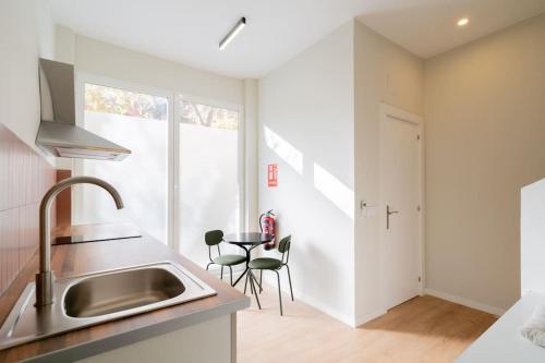 a kitchen with a sink and a table at Nice studio in Madrid-Fp02 in Madrid
