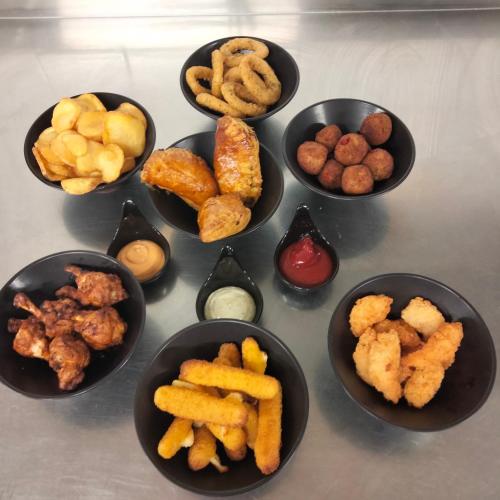 a group of bowls filled with different types of food at le jack in Mont-sous-Vaudrey