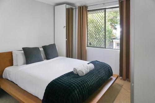Säng eller sängar i ett rum på Comfortconvenience 2-bedroom Unit For Families