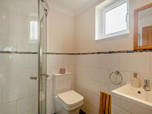 a bathroom with a toilet and a sink at 1 Bed in Brundall 46293 in Brundall