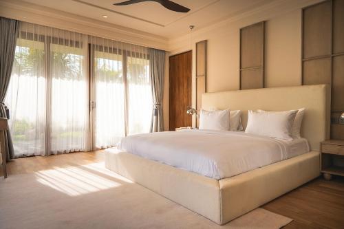 Ein Bett oder Betten in einem Zimmer der Unterkunft Poco Poco villas by Aayan
