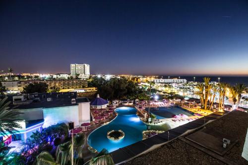 a view of a resort with a pool at night at Royal Mirage Agadir in Agadir