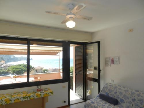 a living room with a view of the ocean at Giglio Rosa 4 n23 in Campese