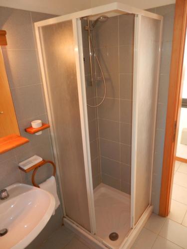 a shower in a bathroom with a toilet and a sink at Giglio Rosa 4 n23 in Campese