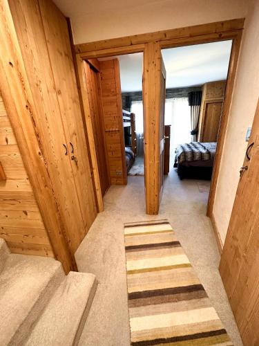 a hallway with wooden walls and stairs in a room at Chalet Flocon - luxury ski chalet by Avoriaz Chale in Avoriaz