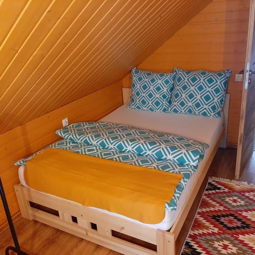 a bedroom with a bed in a attic at Roztocze 3 kroki od sosny in Zamość