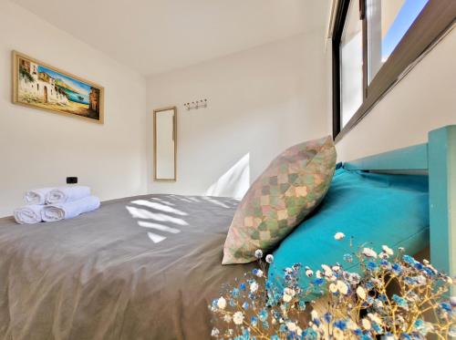 a bedroom with a large bed with a window at Miya del Sol Heated Saltwater Pool in La Orotava