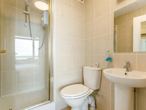 a bathroom with a toilet and a sink and a shower at 3 bed property in Brixham BX034 in Brixham
