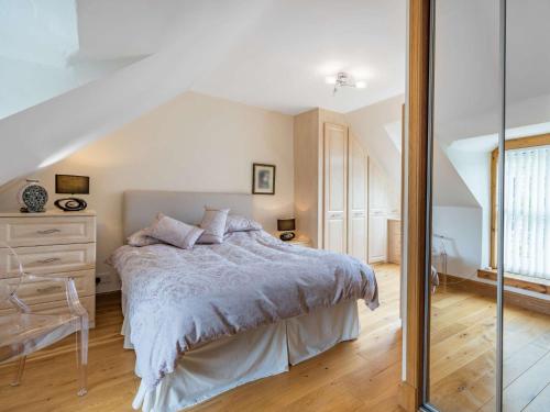 a bedroom with a bed and a staircase at 1 bed in Lauder 57931 in Lauder