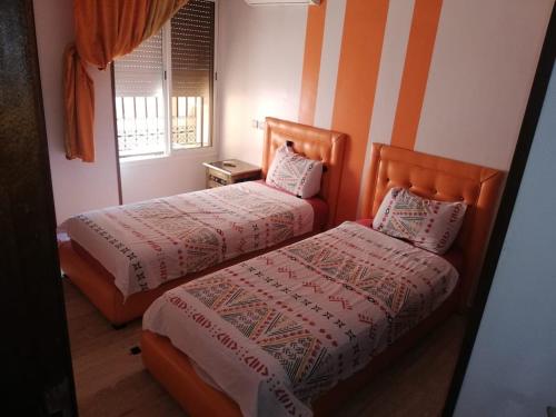 Postel nebo postele na pokoji v ubytování RESIDENCE HAMZA Cosy appartement only family à Gueliz