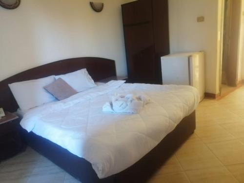 Ένα ή περισσότερα κρεβάτια σε δωμάτιο στο Eiffel Hotel Hurghada