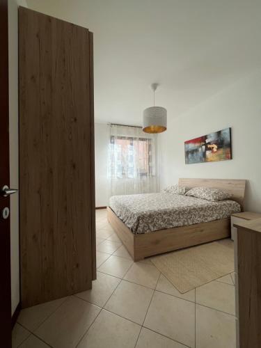 Postel nebo postele na pokoji v ubytování Elegante Casa -Rho Fiera