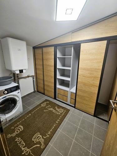 a small kitchen with a stove and a refrigerator at H11 - Evergreen Tale in Bystrá