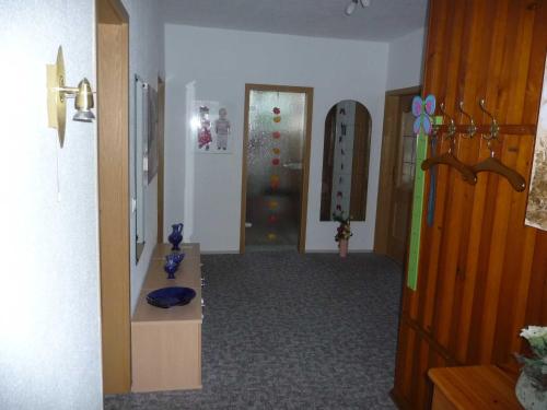 a room with a hallway with a door and a room with a room at Ferienwohnung DZ Blesse Allstedt in Allstedt
