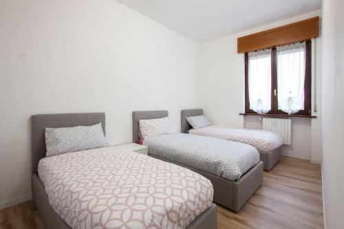 Ένα ή περισσότερα κρεβάτια σε δωμάτιο στο Senago's Home - 15 Minuti Rho Fiera