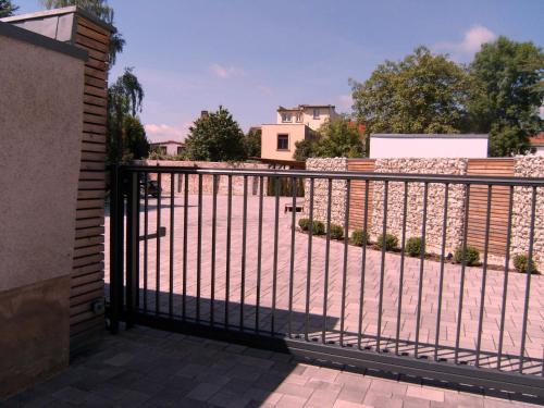 a black metal fence in front of a house at Gästehaus Pacia & Ritter in Sangerhausen