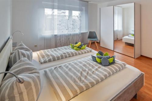 Postel nebo postele na pokoji v ubytování Ferienhaus Heimatdock